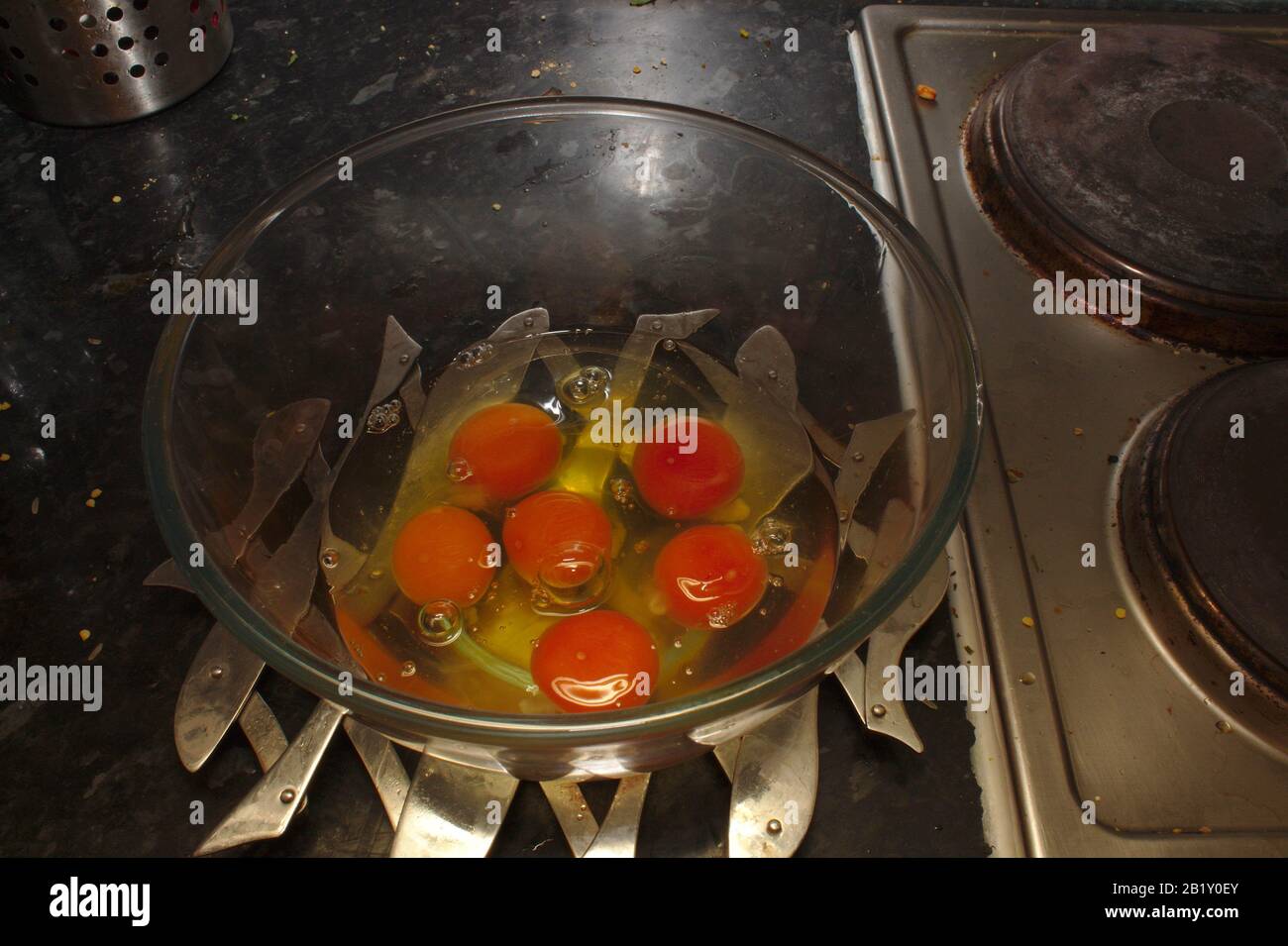 Six cracked eggs Stock Photo