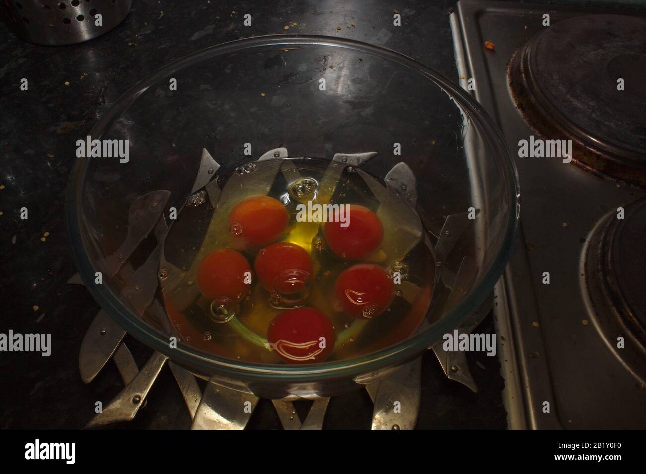 Six cracked eggs Stock Photo