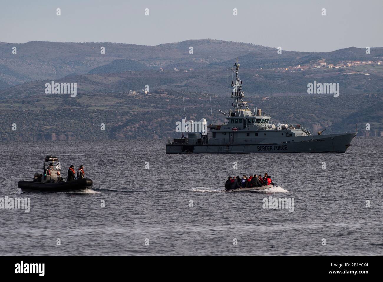 Lesbos, Greece. 28th Feb, 2020. A boat with 15 Afghan refugees, five children, three women and seven men, arrives on the Greek island of Lesbos, in front of the patrol boat of the British border troops HMC Valiant, which is part of the Frontex mission. According to the state news agency Anadolu, a spokesman for the ruling Turkish party AKP barely concealed his threat to open the borders to the refugees in the country. Credit: Angelos Tzortzinis/dpa/Alamy Live News Stock Photo