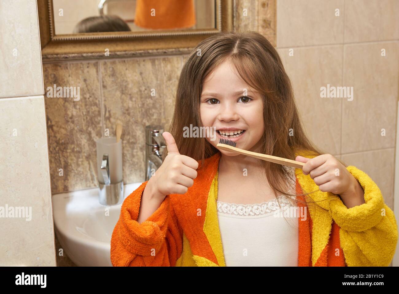 Young girl dental care. Child wash teeth Stock Photo