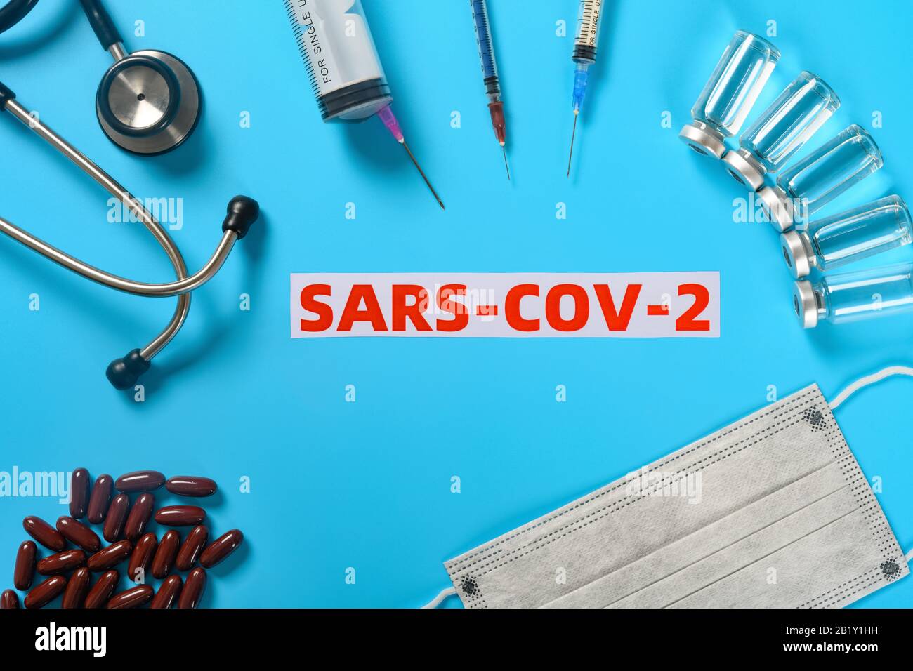 top view SARS COV 2 surrounded by medical things concept of fighting ...