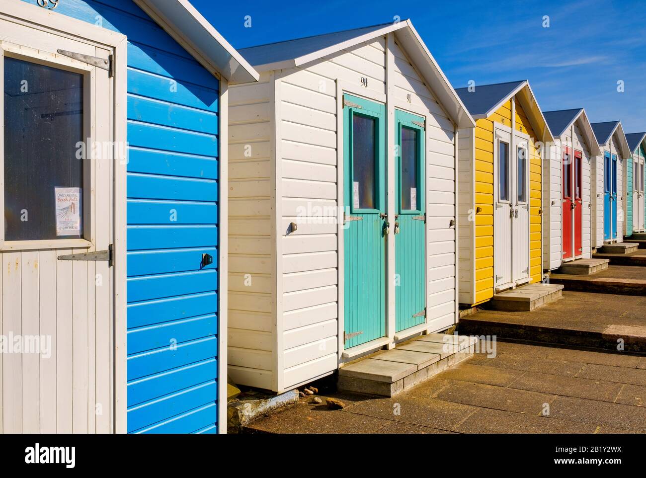 Colourful beach huts, coastal living, beside the sea on the coast, coastal living, lifestyle, holiday destination, bucket and spade holiday, Stock Photo