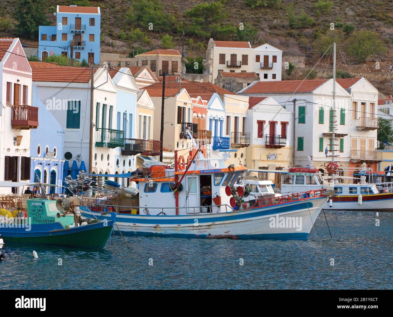 Evening mood at Meis island, also known as Kastellorizo, fishing boats in the harbour, Meis island, Greece Stock Photo