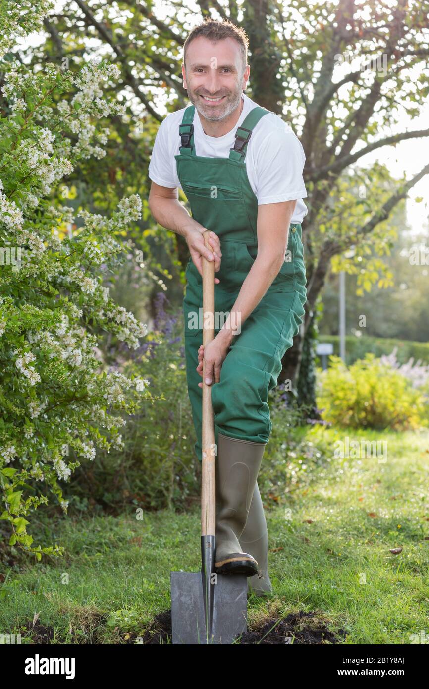 Farmer in coveralls hi-res stock photography and images - Alamy