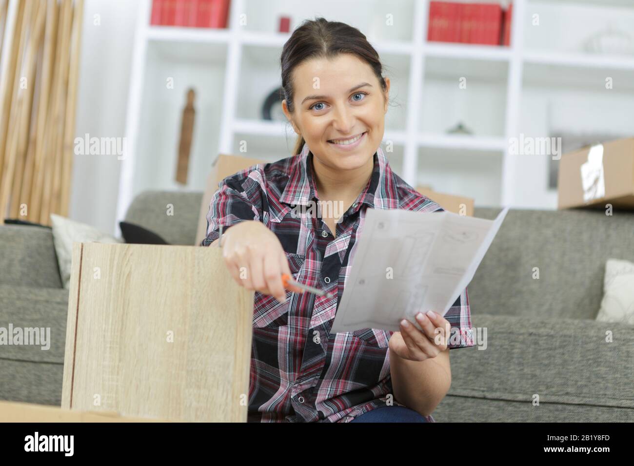 Person reading instruction manual hi-res stock photography and images ...