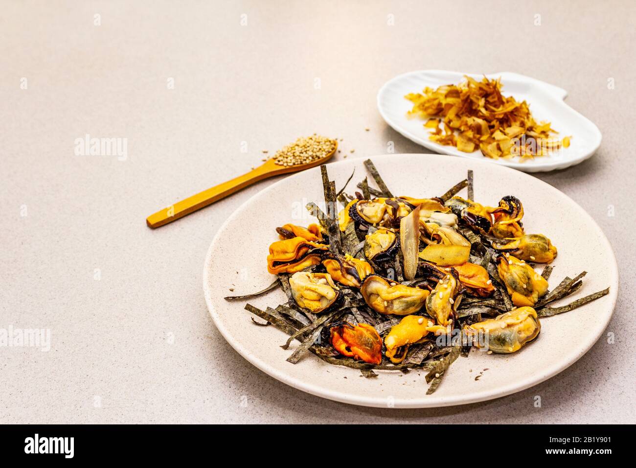 Mussels with nori seaweed, sesame and tuna bonito flakes. Superfood concept. Healthy vegetarian