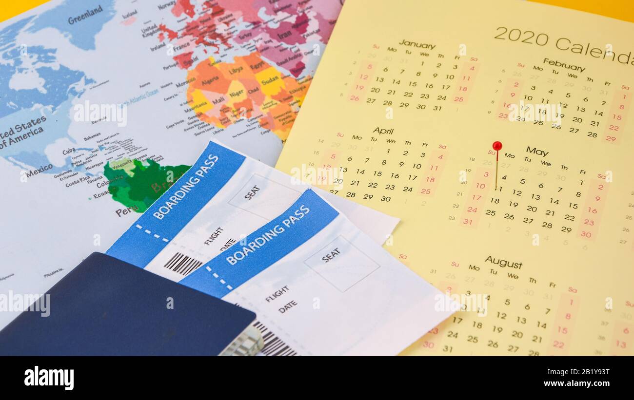 passport, boarding pass over map. travel concept., on calendar with pins Passport on map ticket, planning trip Stock Photo