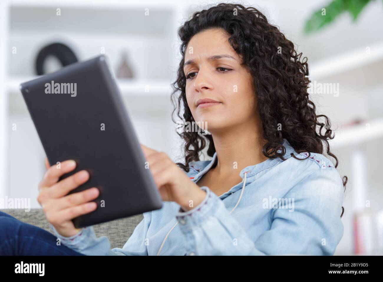 young woman with tablet at home Stock Photo - Alamy
