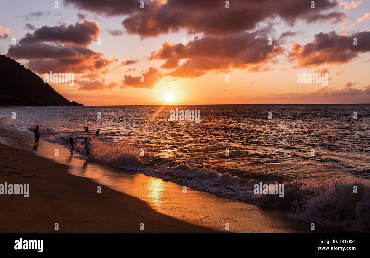 Sunset at Anse de la Perle, Death in Paradise beach,  Saint Marie, Deshaies, Guadeloupe Stock Photo