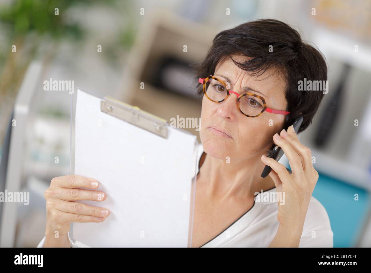 a supervisor with a smartphone Stock Photo