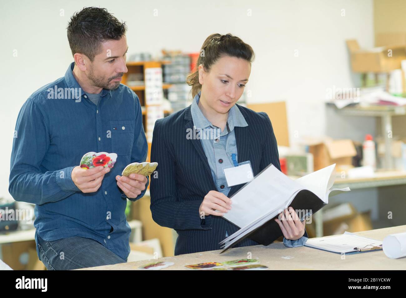 make customer picking an appropriate design for his ads Stock Photo