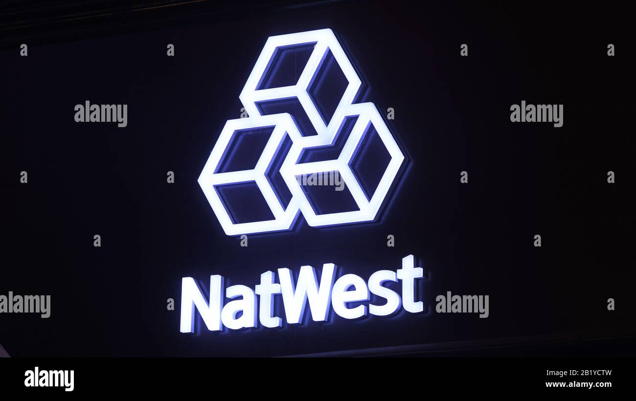 natwest logo on bank branch at night united kingdom Stock Photo