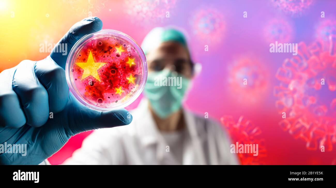 Corona Virus Scientist With Protective Mask And Gloves Holding Cell Colture Petri Dish Stock Photo