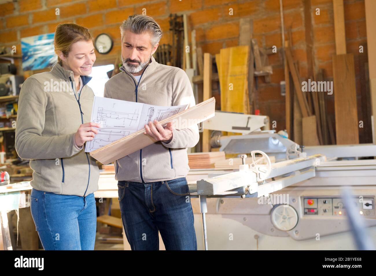 carpentry manager and foreman studying a blueprint Stock Photo Alamy