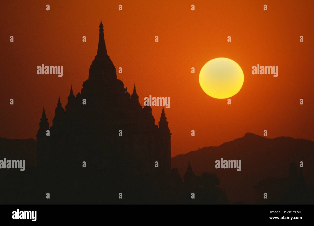 Sun setting behind Thatbyinnyu Temple, Pagan, Burma. Stock Photo