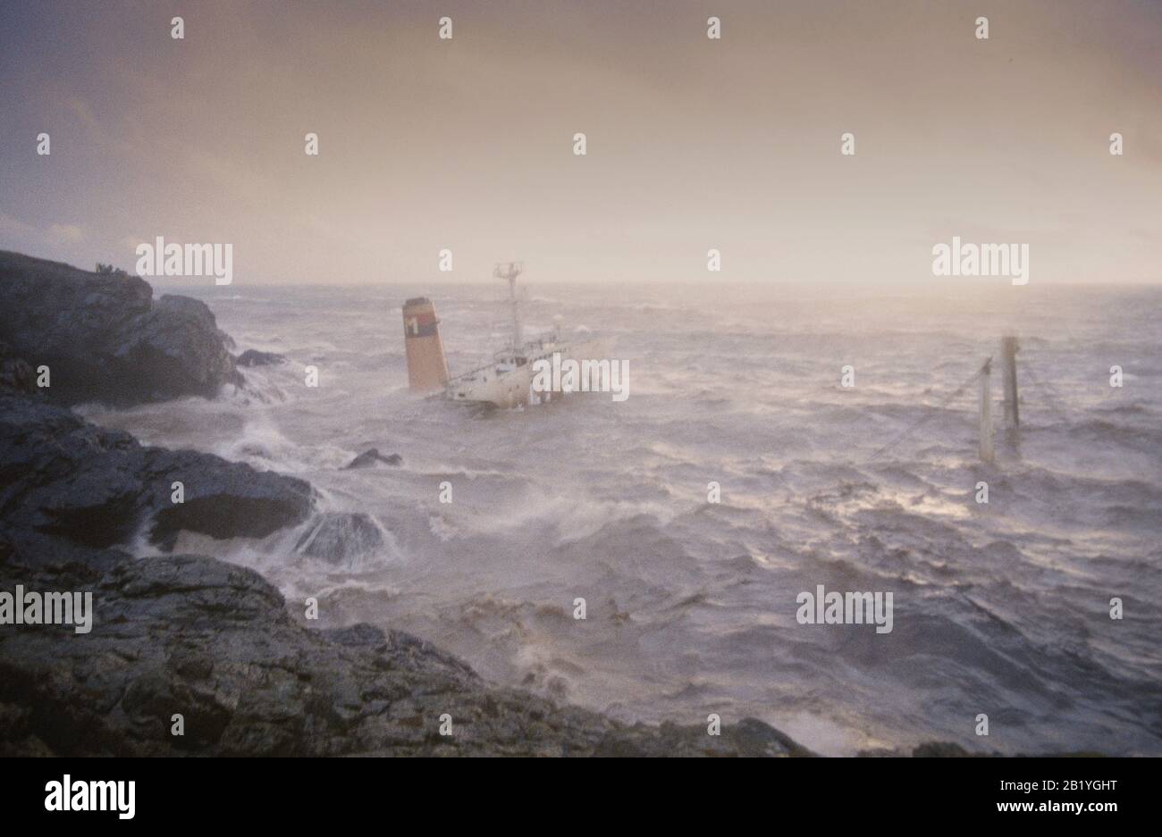 MV Braer aground in Garths Ness Shetland with it's hull now broken in two during hurricane force winds 1993. Stock Photo