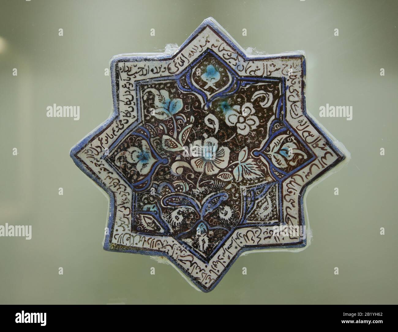 Tiles. Lustre technique glazed. 8 pointed star. Ilkhanid period. Kashan, Iran. 13th cent. Istanbul Archaeology Museums. Museum of Islamic Art. Stock Photo