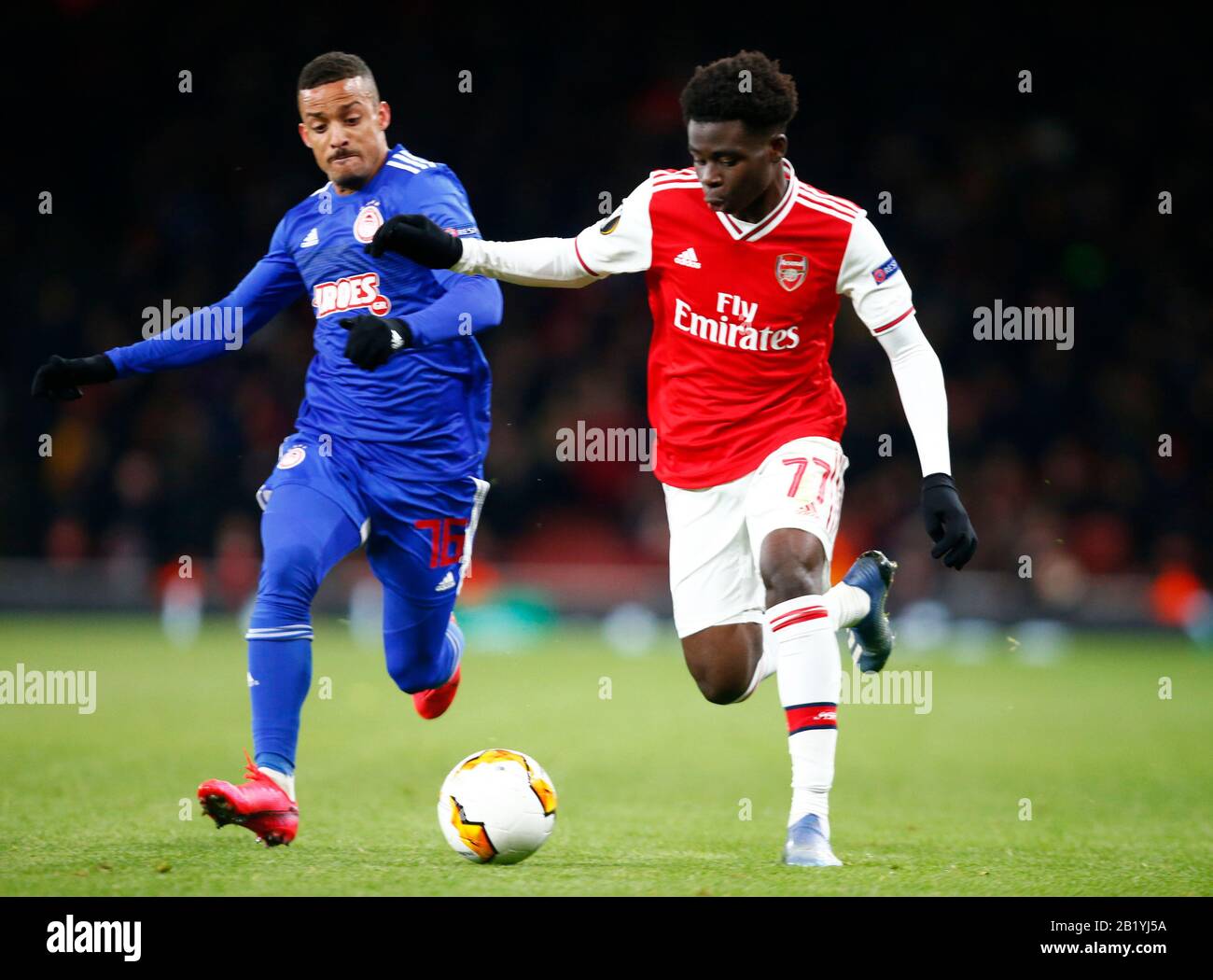 LONDON, United Kingdom, FEBRUARY 27 L-R Bruno Gaspar of Olympiacos (on loan  from Sporting CP) and Bukayo Saka of Arsenal during Europa League Round of  Stock Photo - Alamy