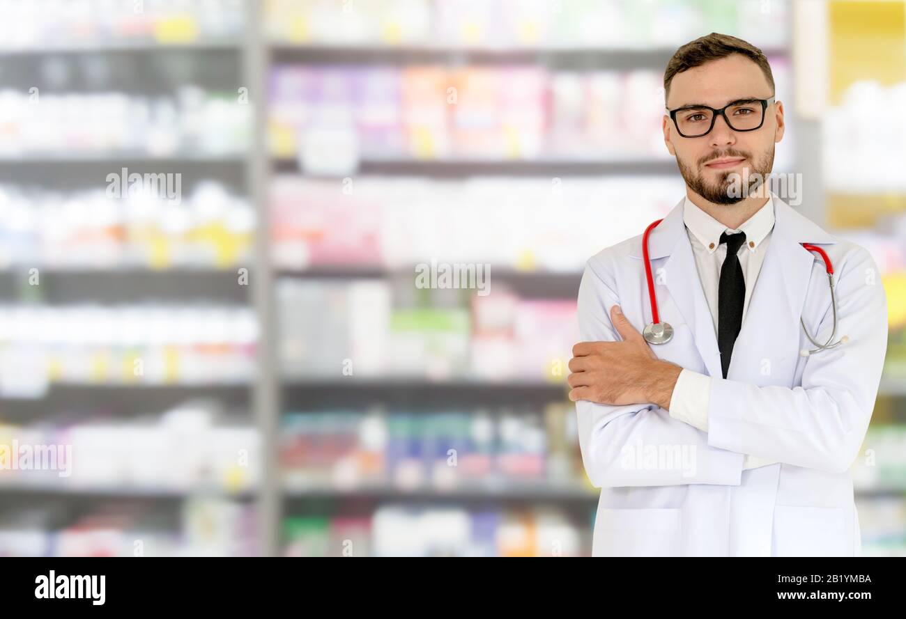 Young Male Pharmacist Working At The Pharmacy. Medical Healthcare And ...