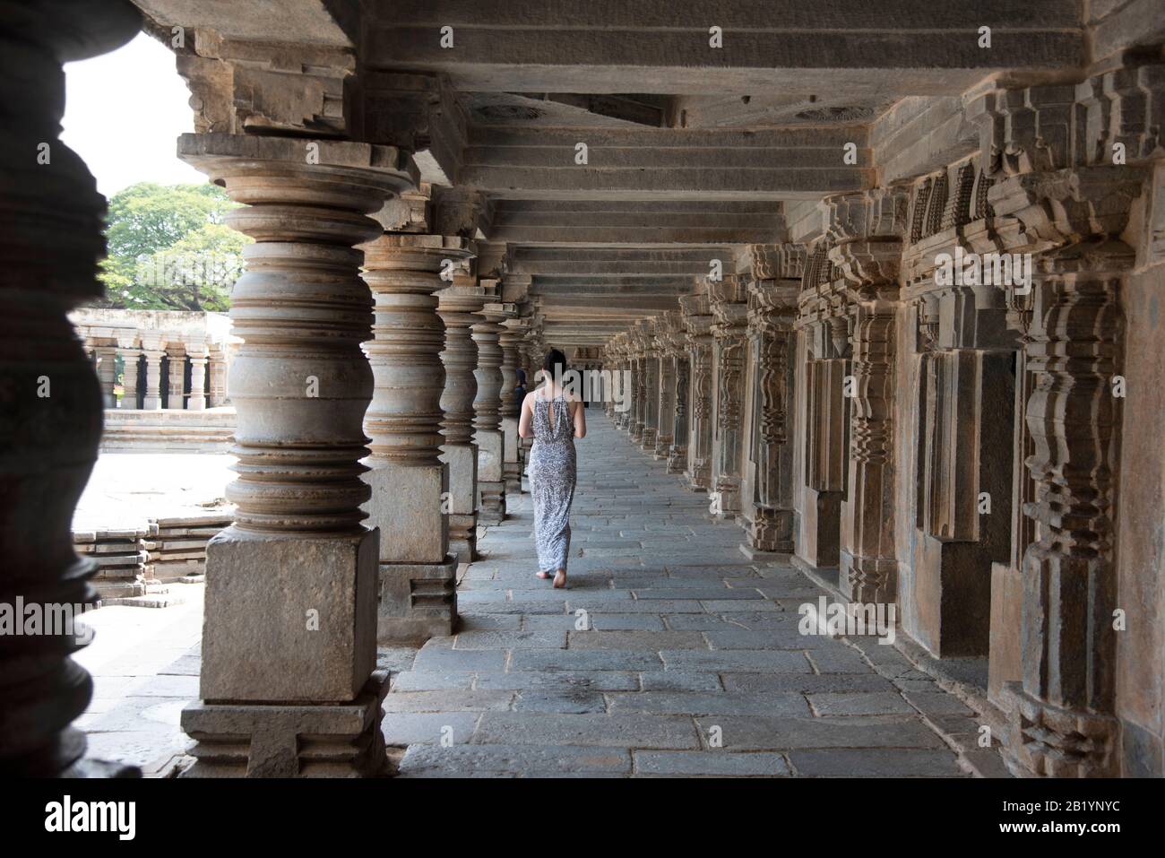 Somanathapura, Karnataka, India, November 2019, Tourist walking the  corridors and carved pillars of the Chennakesava Temple Stock Photo