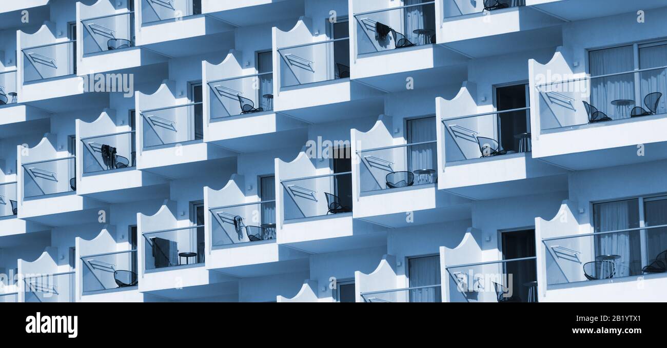 Portrait of hotel or apartment building with balconies Stock Photo - Alamy