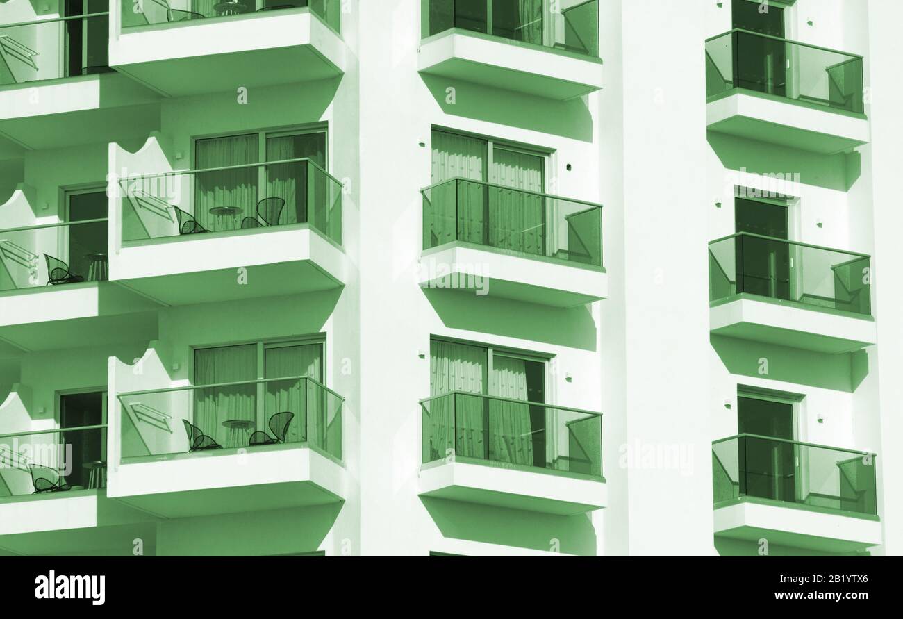 Portrait of hotel or apartment building with balconies Stock Photo - Alamy