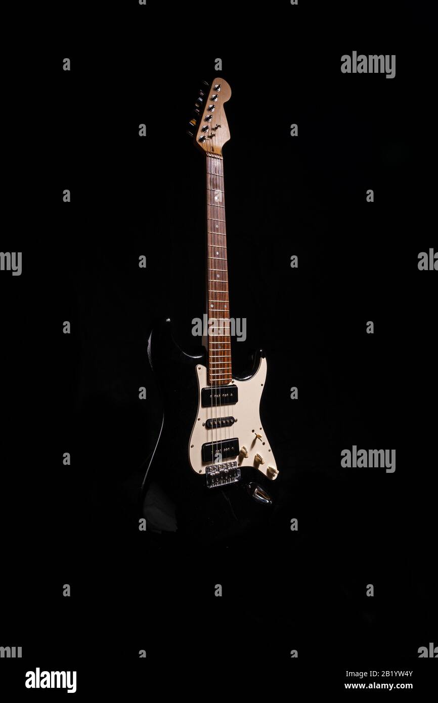 Electric guitar on plain black background Stock Photo