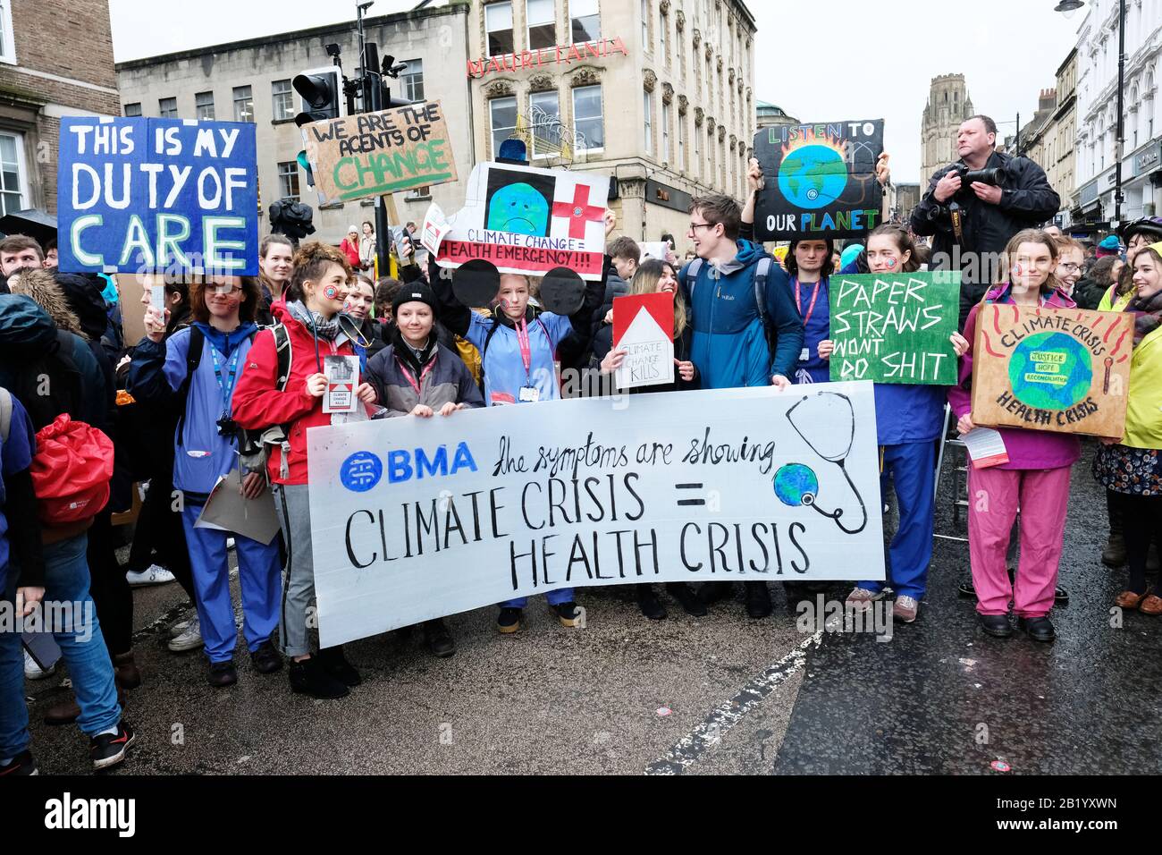 Bristol, UK - Friday 28th February 2020 - Young medical students and protesters gather at the start of the march through the rain to support the Bristol Youth Strike 4 Climate march. Credit: Steven May/Alamy Live News Stock Photo
