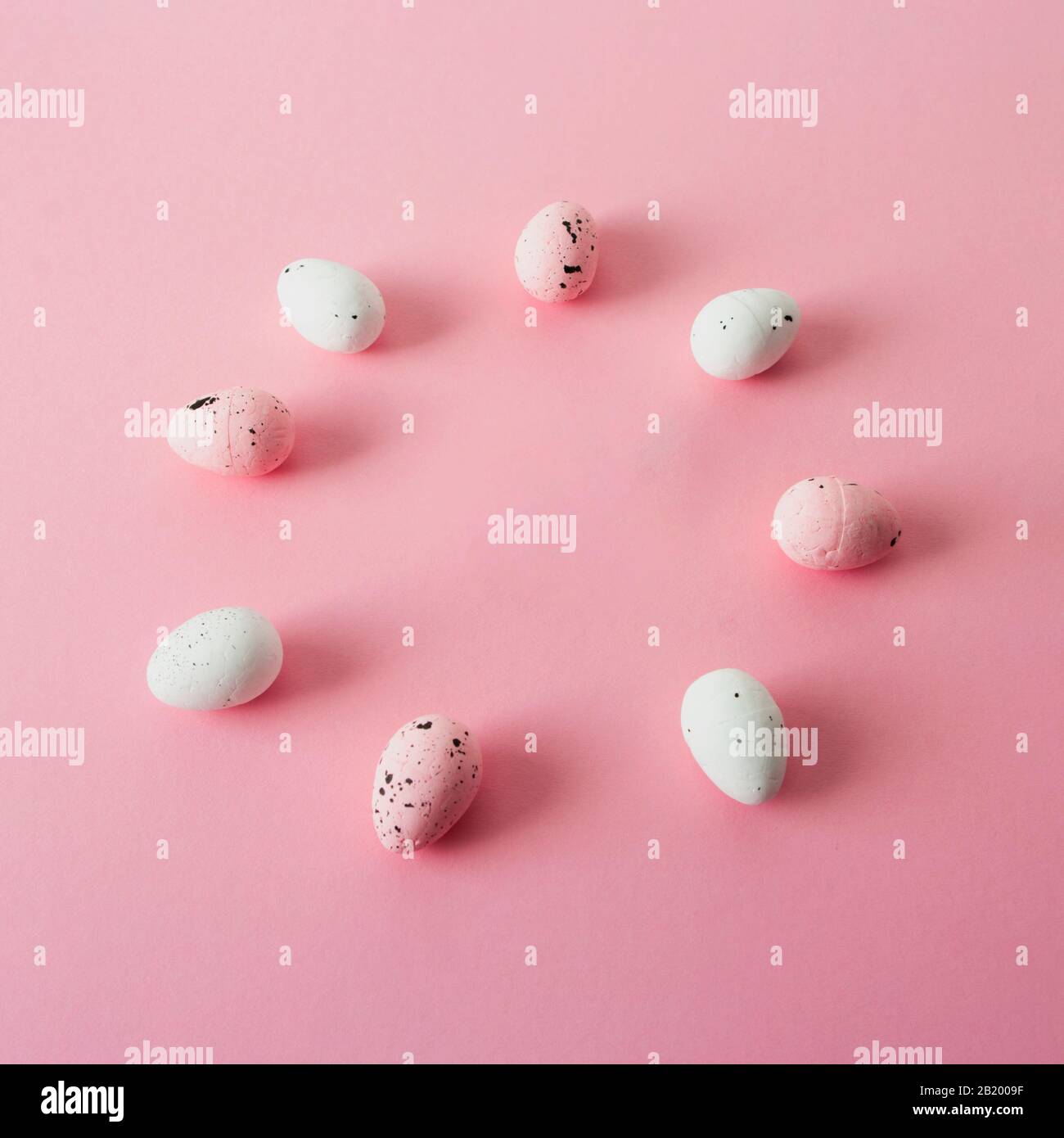 Pink and white easter eggs, quail, circle frame. Stock Photo