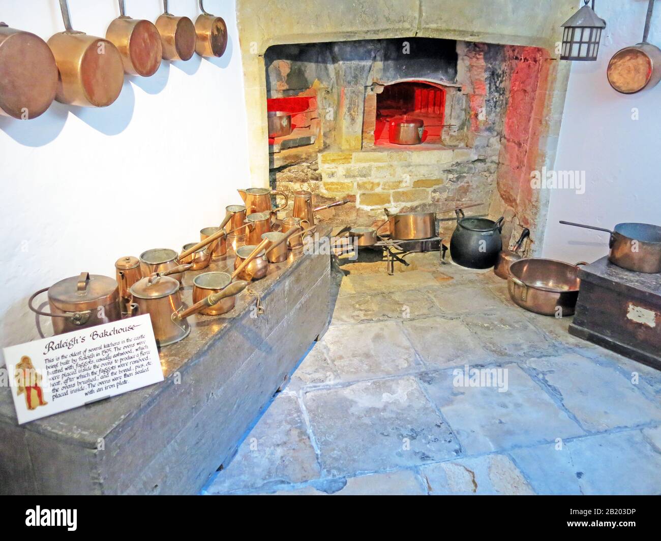 Raleigh's Bakehouse in the cellars of Sherborne 'New' Castle complete with copper pots and pans, Sherborne, Dorset, England, UK Stock Photo