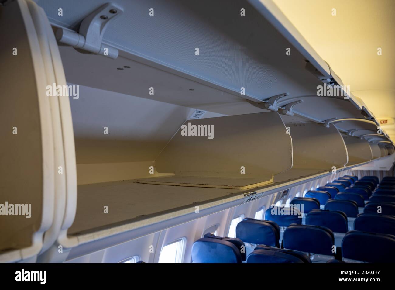 Empty overhead passenger bins of a passenger aircraft Stock Photo