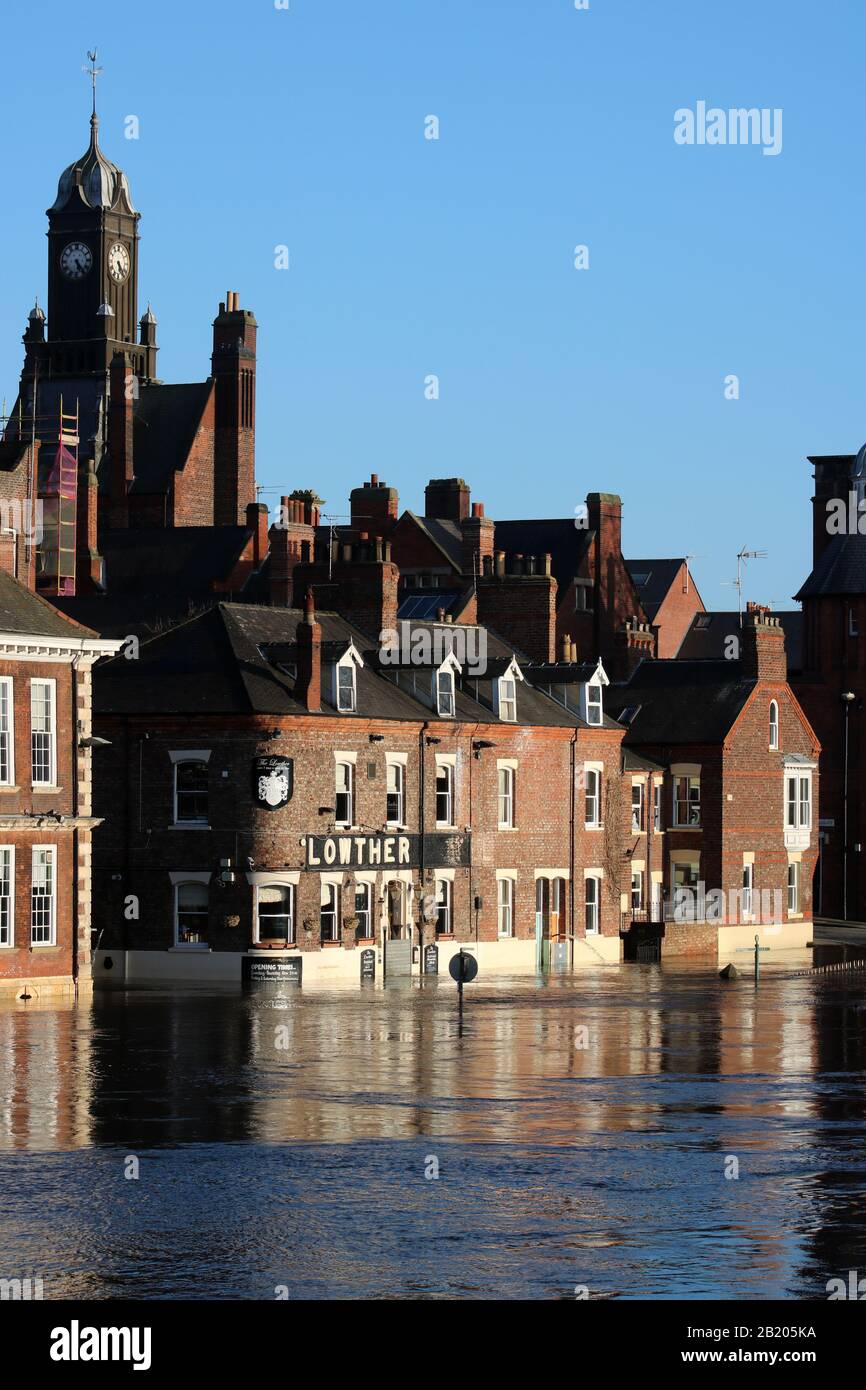 View of swollen River Ouse in York, February 2020, showing flooding to Lowther Hotel and riverside buildings, Kings Staith and Cumberland Street. Stock Photo