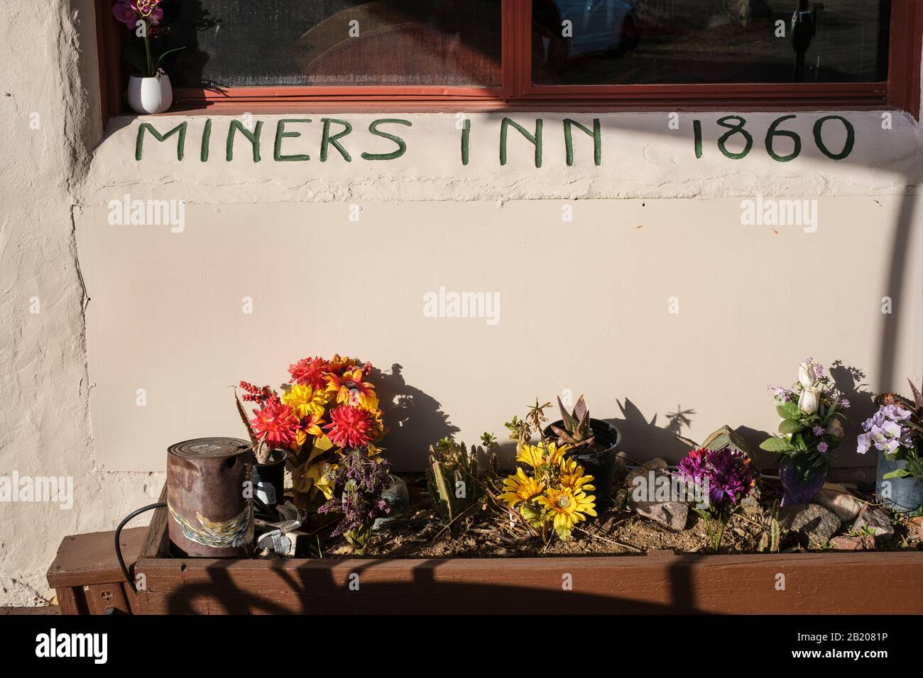 Miners Inn 1860 painted on wall at Shep's Miners Inn & Yesterdays Restaurant, Chloride, Arizona, 86431, USA. Stock Photo