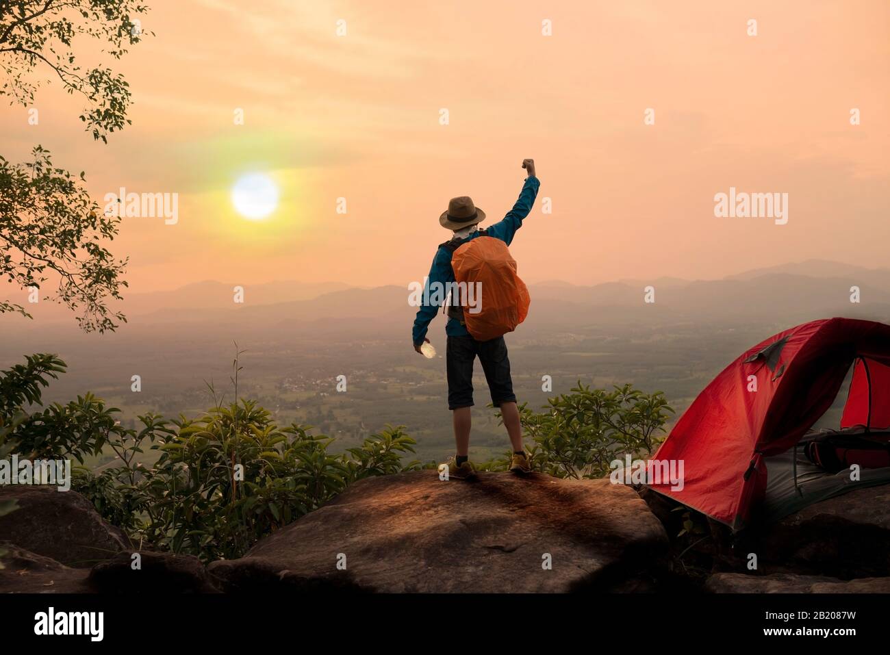 Backpacker rising hands on hi-res stock photography and images - Alamy