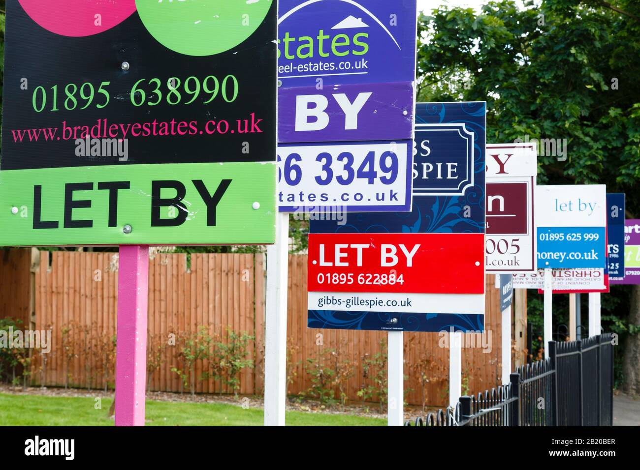 LONDON, UK - August 19, 2013. To let estate agent signs in a row advertising property in UK Stock Photo