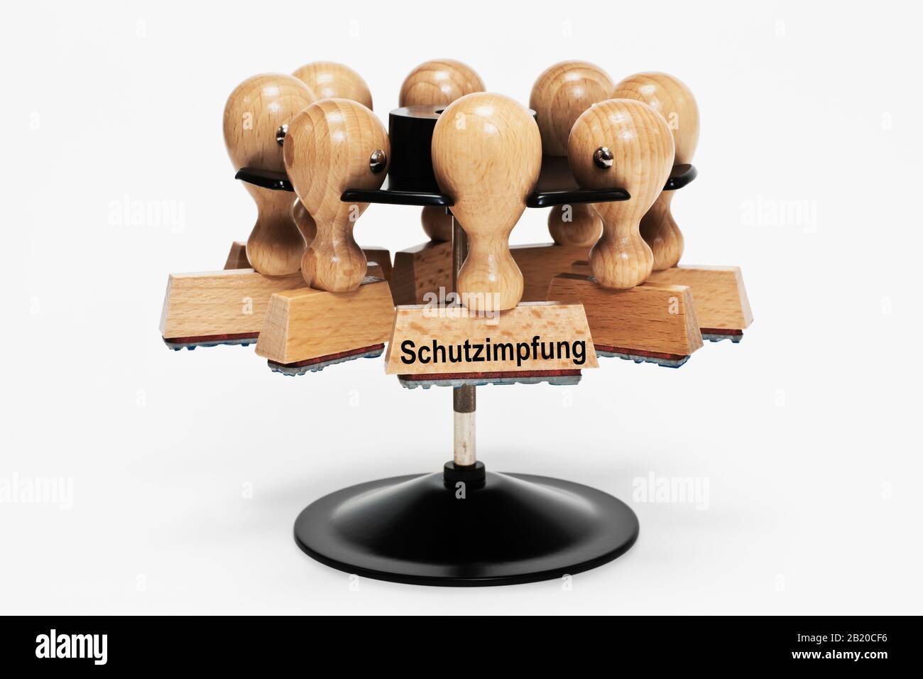 a stamp with the inscription Schutzimpfung (Protective vaccination) hangs in a stamp rack Stock Photo