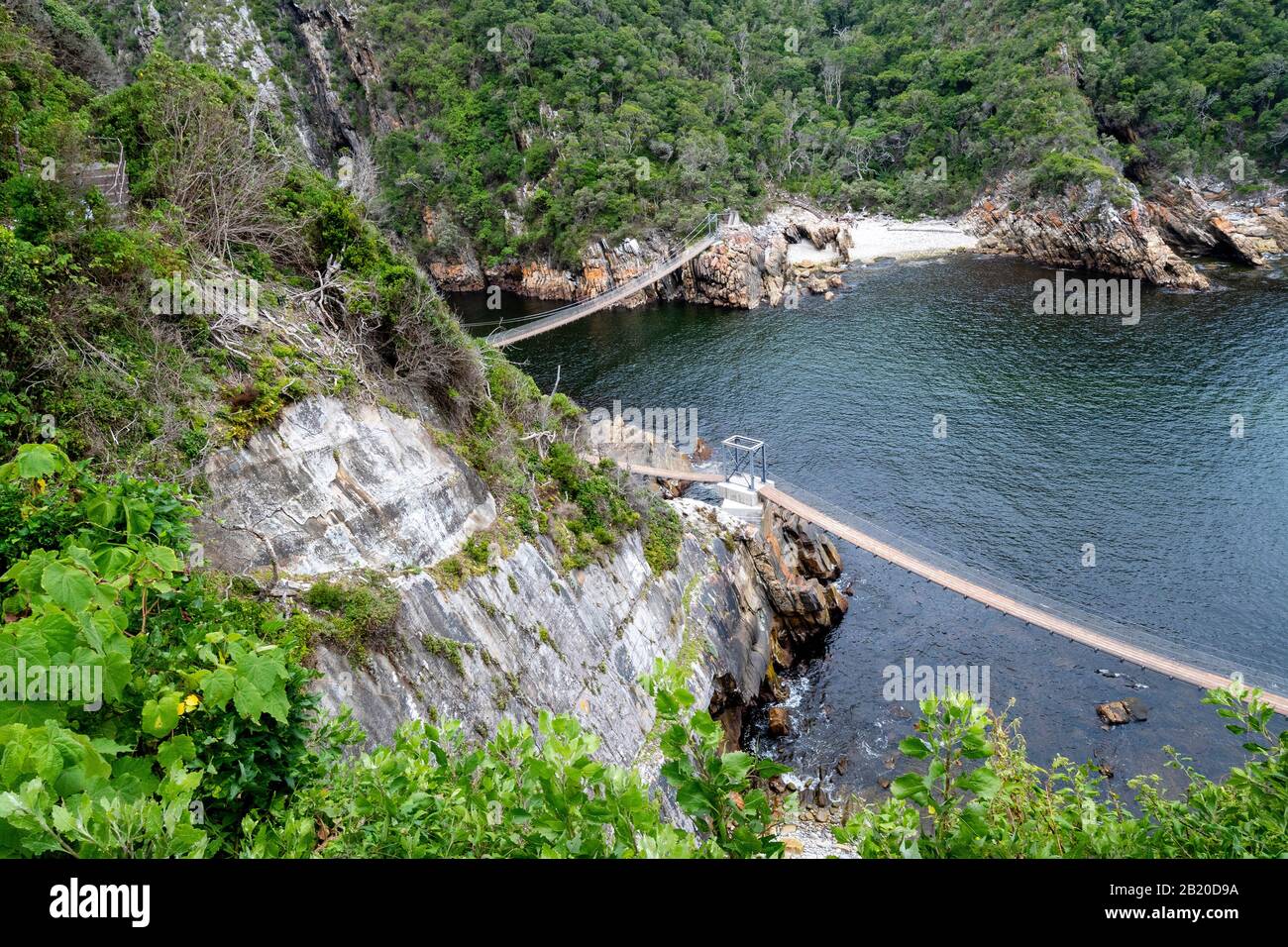 High aspect view from footpath of the suspension bridges at Storms River Mouth,Tsitsikamma National Park,Garden Route,near Port Elizabeth,South Africa Stock Photo