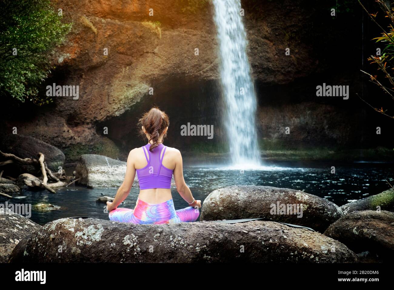 woman practice yoga in front of waterfall Stock Photo - Alamy