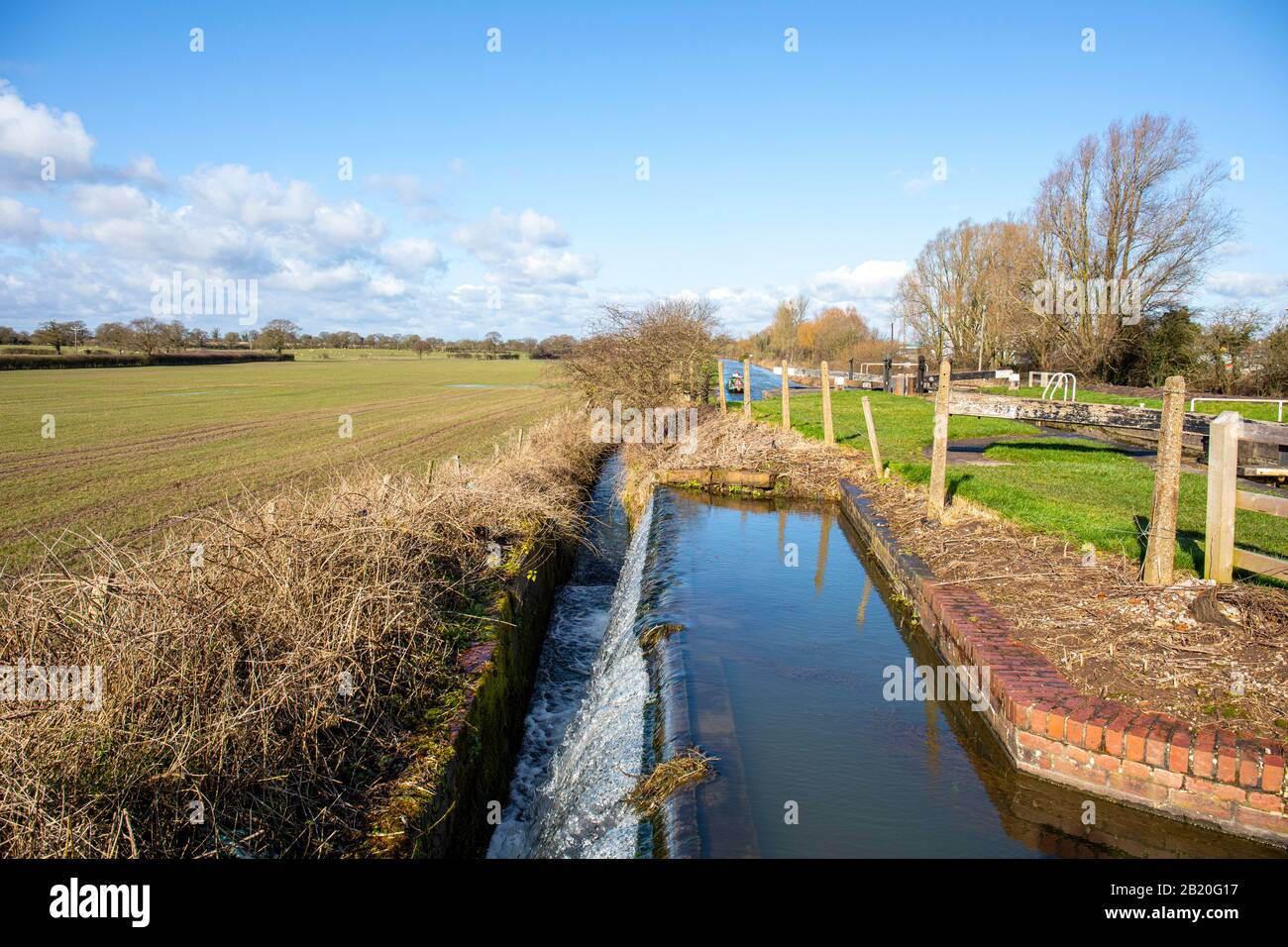 Overflow next to lock on the Trent and Mersey Canal in Cheshire UK Stock Photo