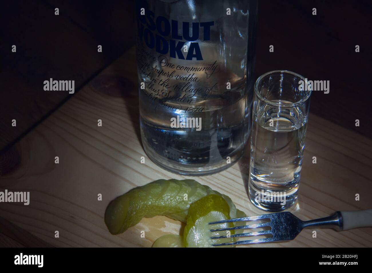 Izhevsk, Russia January 6, 2020: Bottle of Absolut vodka, a glass and a pickle appetizer Stock Photo