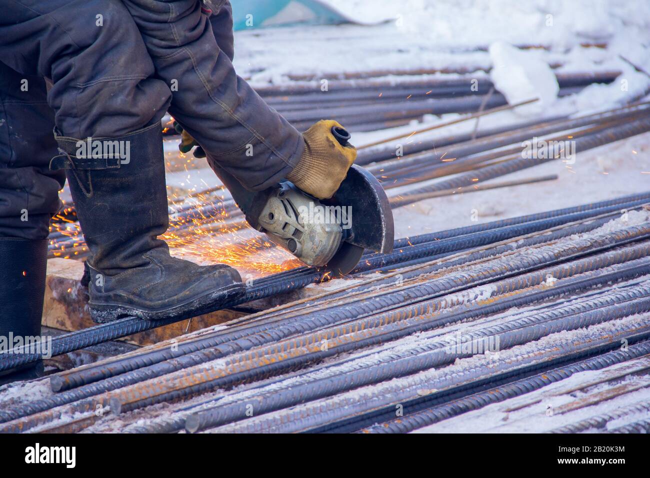 Worker cutting steel bars. Metal cutting with an electric tool Stock Photo Alamy