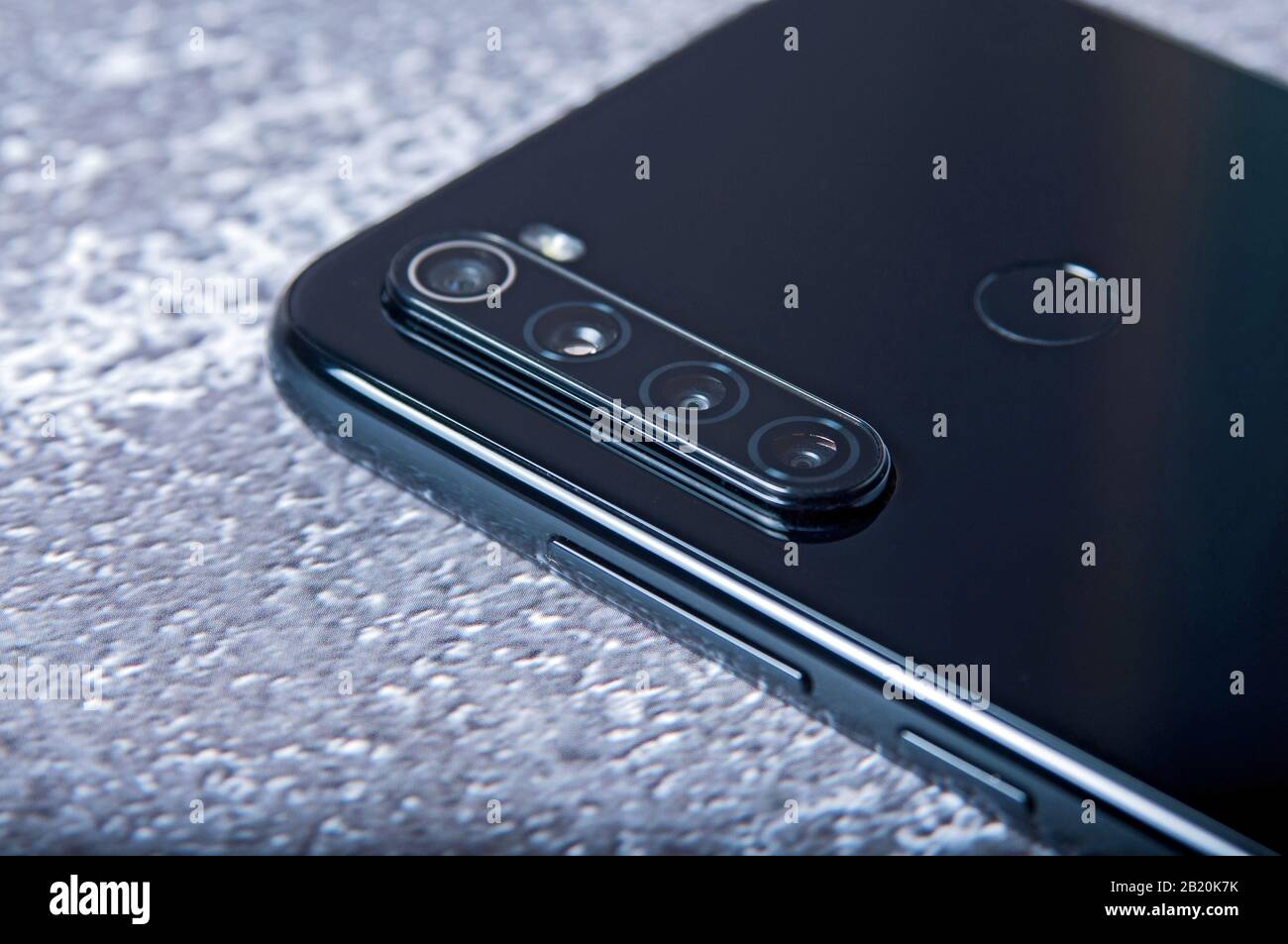 Mobile phone with four cameras. Modern device Stock Photo - Alamy