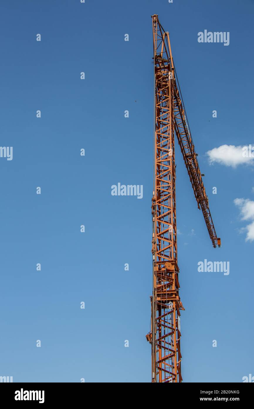 yellow crane on construction site Stock Photo