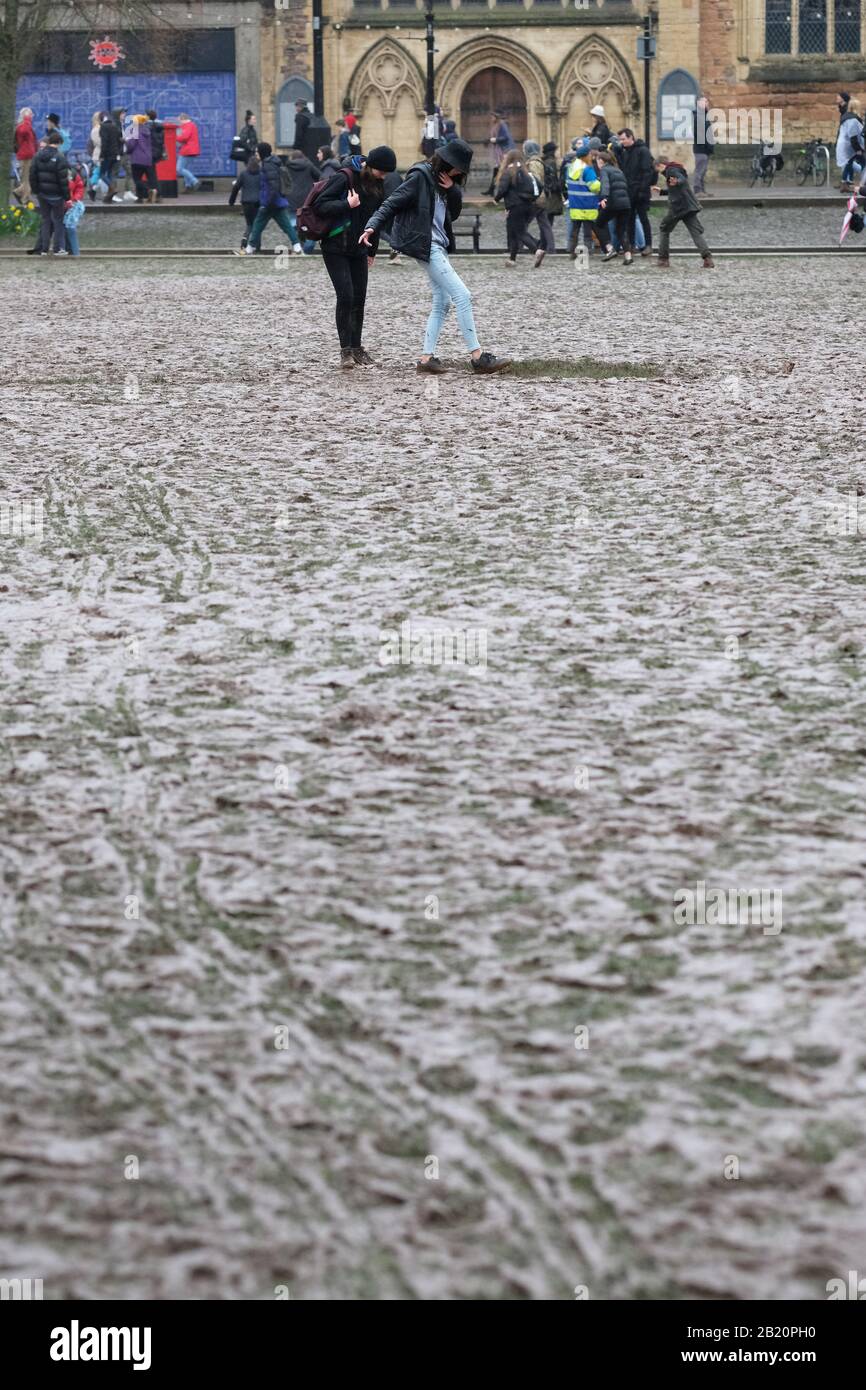 Bristol, UK - Friday 28th February 2020 - Young climate change protesters make their way across the muddy ruined grass on College Green after the gathering by Bristol Youth Strike 4 Climate.  Photo Steven May / Alamy Live News Stock Photo