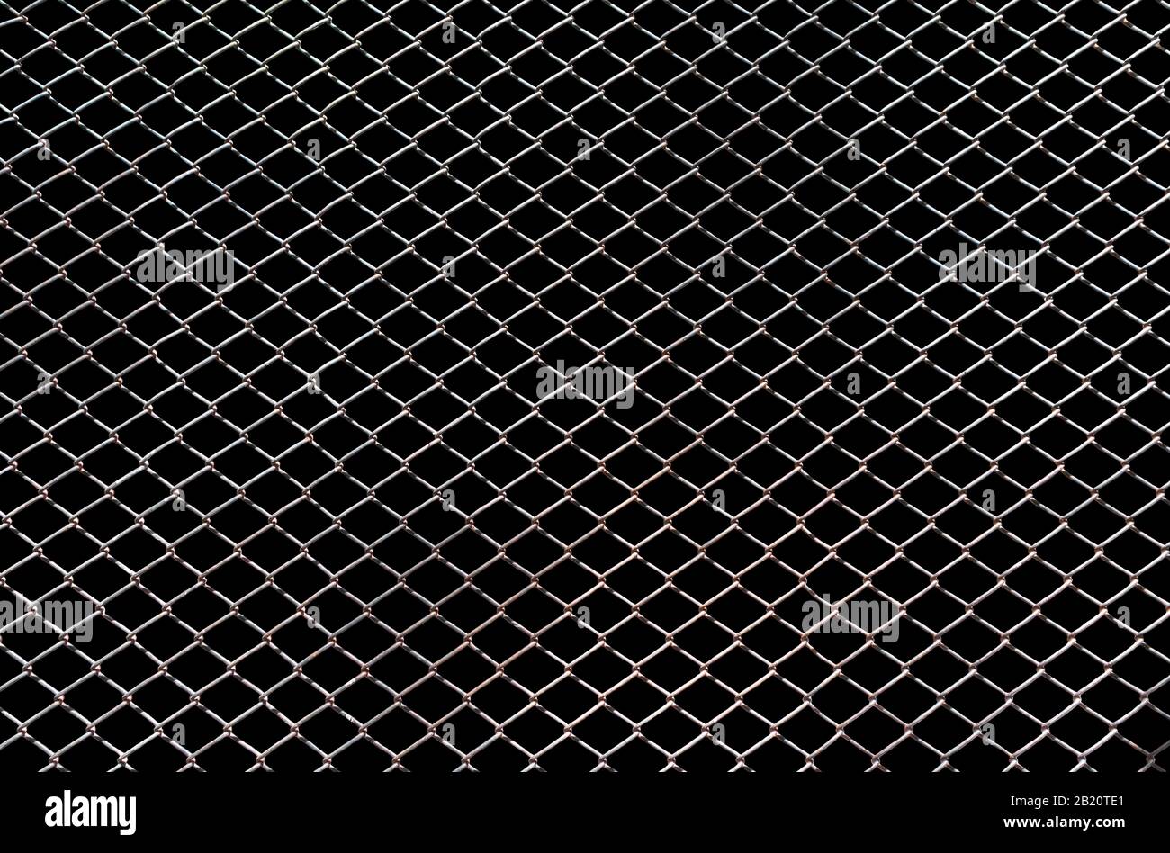 Steel mesh wire fence isolated on black background with clipping path ...