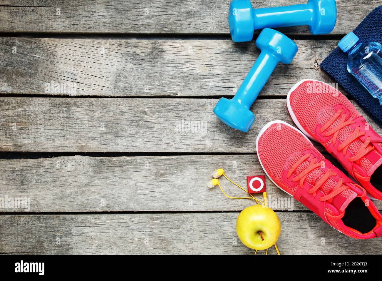 Set of sports accessories for fitness concept with exercise equipment on  gray background. Background view from above Stock Photo - Alamy