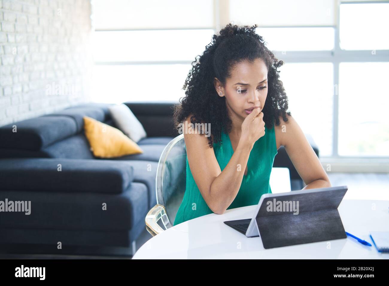 Young Black Woman Feeling Anxious And Biting Nails Stock Photo