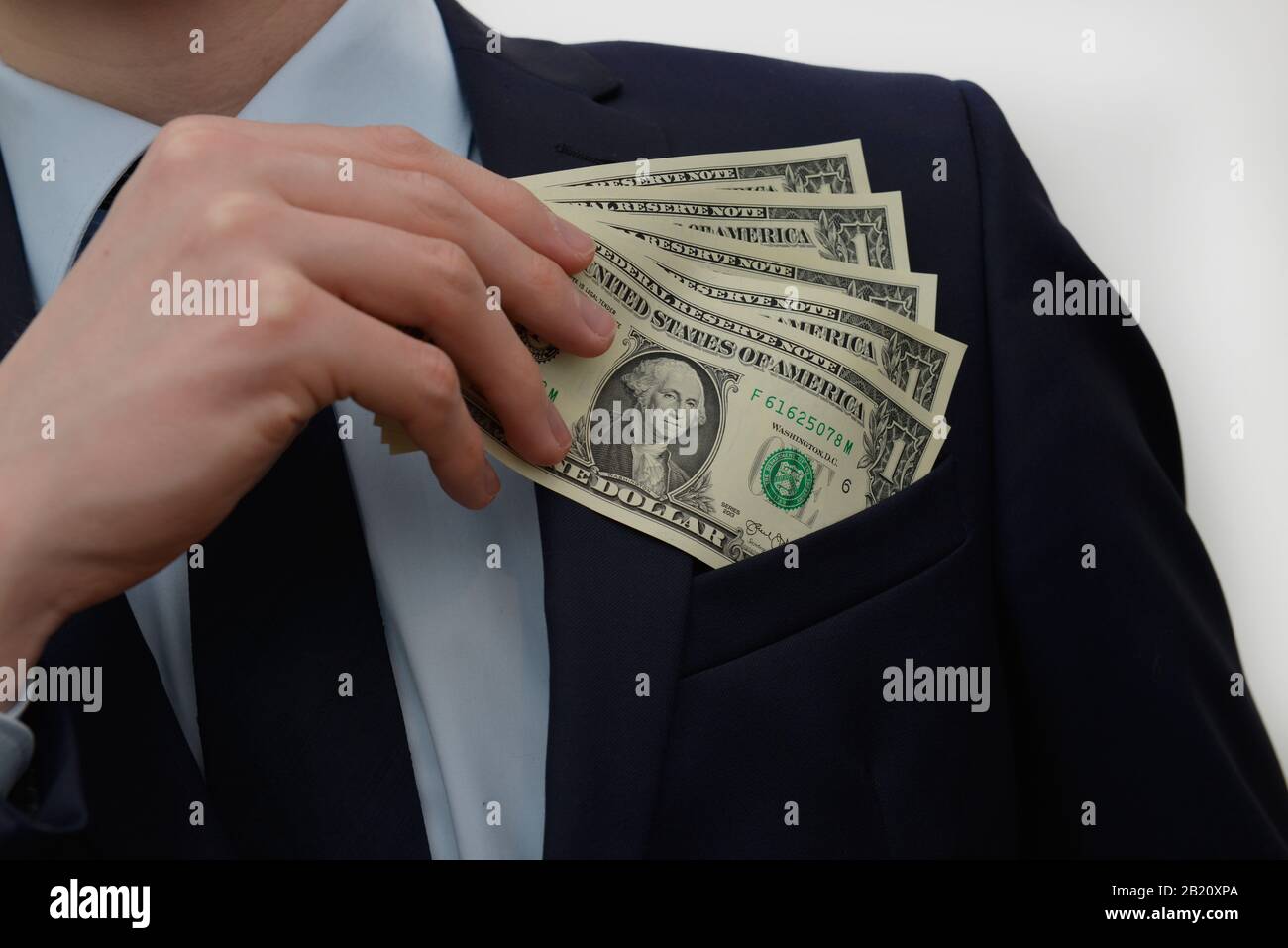 Hand Geld Einstecken Dollars Stock Photo