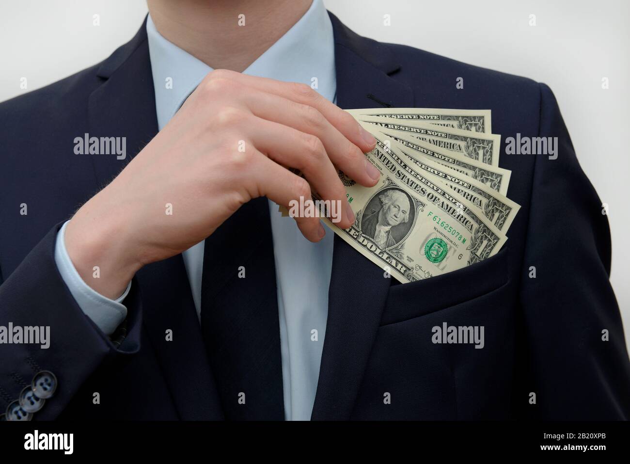 Hand Geld Einstecken Dollars Stock Photo