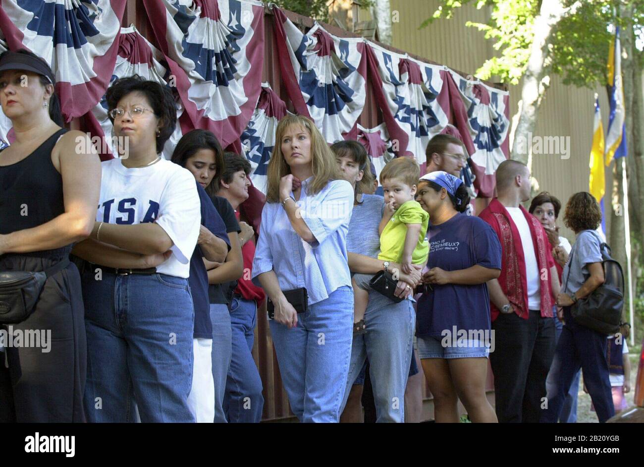 September 14, 2001, Austin, Texas: Customers wait in a long line at a small business in south Austin that specializes in flag sales. Stores were swamped with customers looking for symbols of patriotism following the terrorist attacks on the World Trade Center and Pentagon on Sept. 11. ©Bob Daemmrich Stock Photo